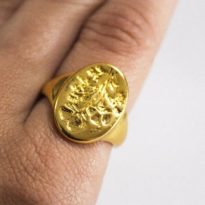 Carved gold ring with wildflowers